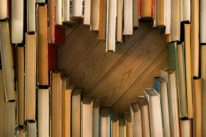 Looking at books from above, arranged so that they create a heart