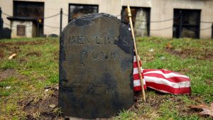 Paul Revere's grave as it stands in Granary Burying Ground with an American flag next to it