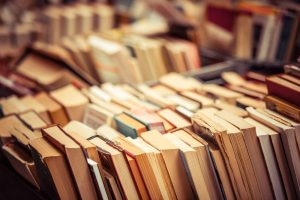 Looking at a collection of books, focusing on the pages from the side