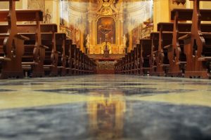 Interior of a Catholic church with pews and altar