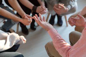 Person sharing at a grief support group