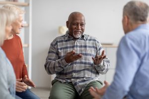 man talking at a grief support group