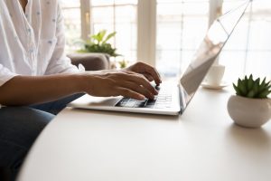 Person typing on a laptop