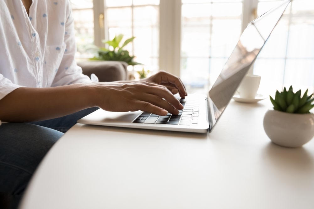 Person typing on a laptop