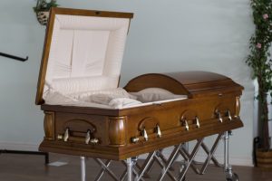 Open wooden casket with ivory lining