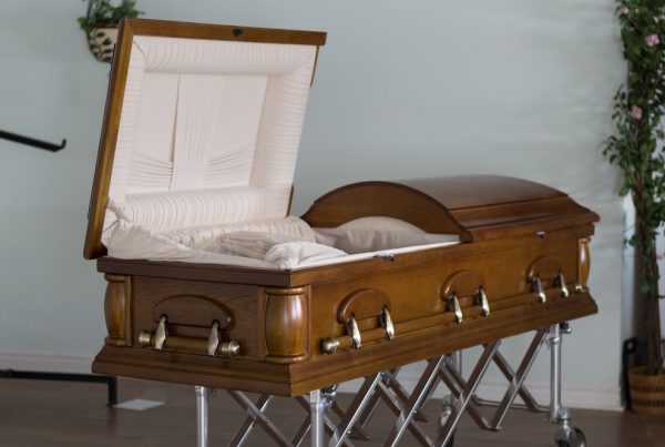 Open wooden casket with ivory lining