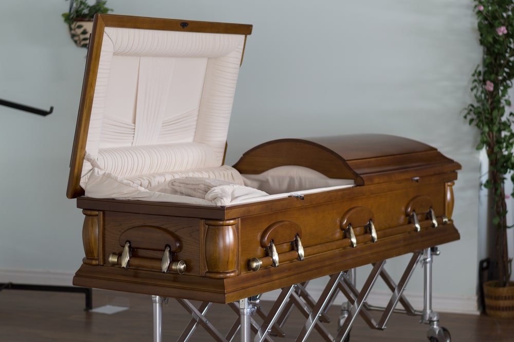 Open wooden casket with ivory lining