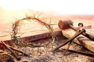 Depiction of the crown of thorns, cross, and nails that pierced Jesus's hands