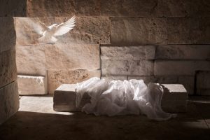 Depiction of Jesus's empty tomb with linen lying flat on the stone