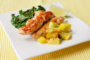 small meal with chicken, pineapple, and greens