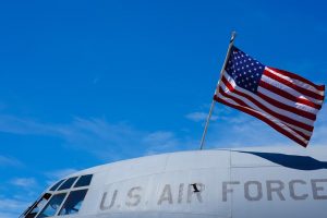 Cockpit of Air Force aircraft with American flag prominently displayed