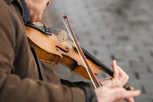 Older man playing a violin