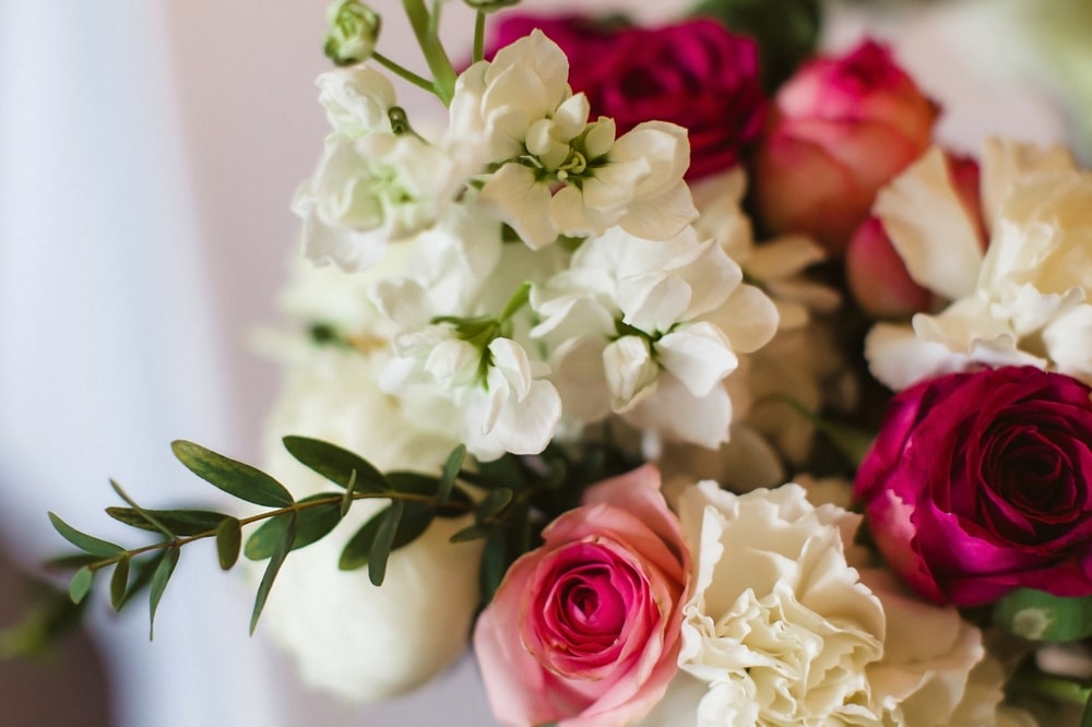 bouquet of white flowers and pink and red roses