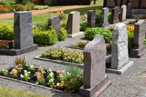 Well-maintained headstones and graves in a cemetery