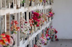 Wall of cremation niches with flowers