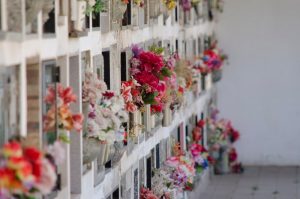 Wall of cremation niches with flowers