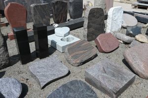 variety of headstones and grave markers of different materials