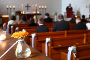 Funeral service at church with speaker in front