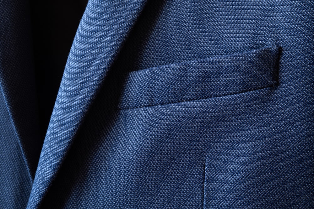 Navy blue suit jacket as a piece of clothing for a viewing