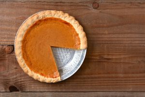 Store-bought pumpkin pie with a slice missing