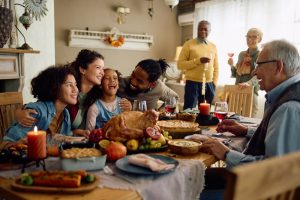 Three generations of a family eating together at Thanksgiving