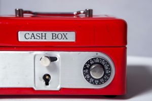 Closed red metal cash box