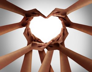 people holding their hands together to create a heart