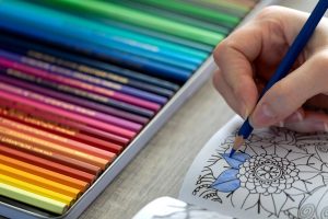Focus on colored pencils and right hand coloring a page