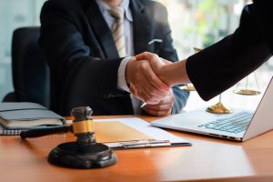 Shaking hands with an attorney