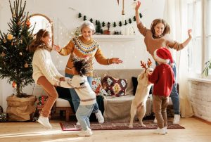 Family dancing to Christmas playlist, enjoying time together