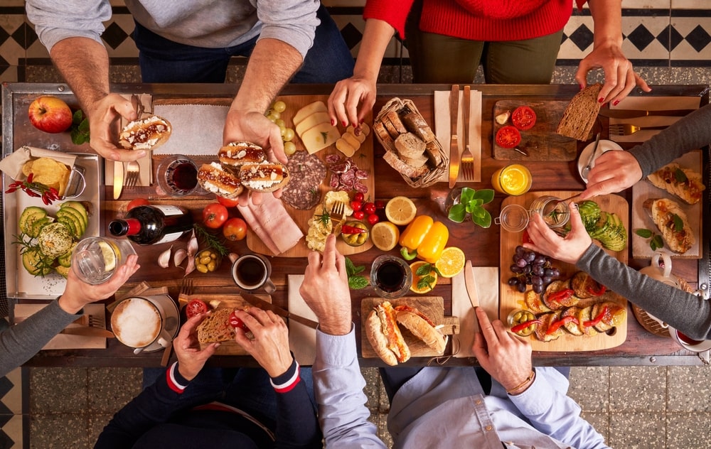 group of people getting food at a gathering