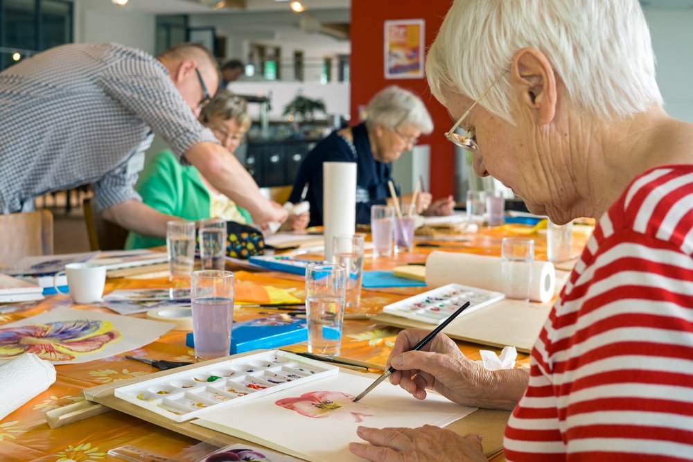 group of people in hospice painting