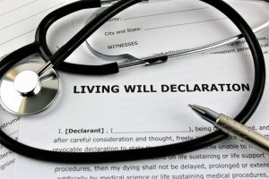 Black stethoscope laying on paperwork that says "Living Will Declaration"