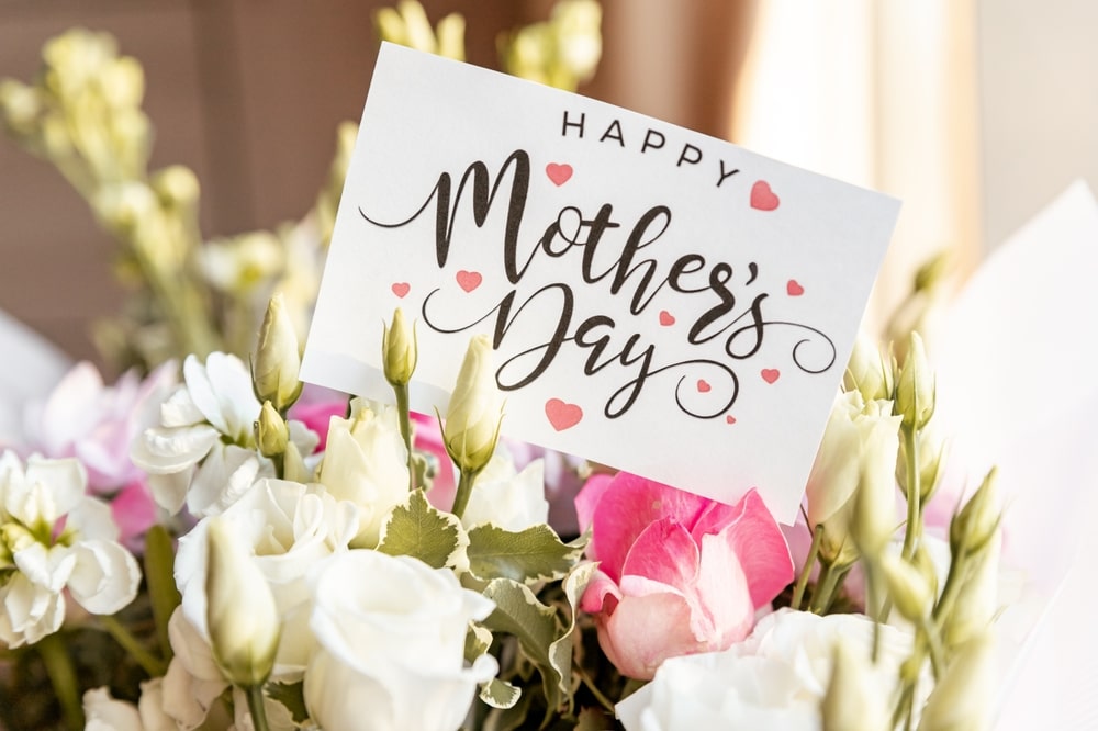 bouquet of flowers with a Mother's Day card sticking out of the top