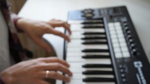 Man playing the piano; funeral songs