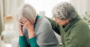 Family member comforting a loved one who is experiencing depression; mature couple