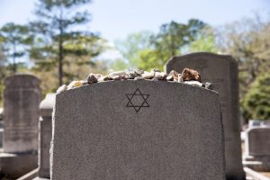 Jewish memorial marker with remembrance stones