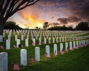 Grave markers at a national cemetery at sunrise