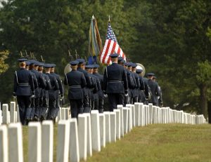 Military honor guard conducting military honors at a national cemetery