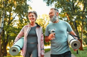 Man and woman exercising outside