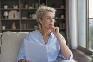 Older woman looking thoughtful