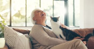 elderly woman enjoying time with her cat