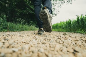 Close up of shoes walking on a path.