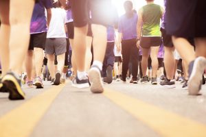 Close up of a group of people's legs all walking together