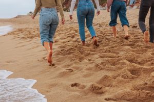 group walking along a beach