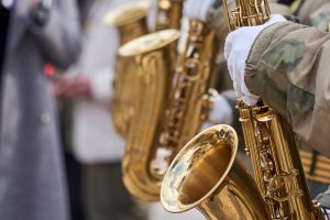 Person in uniform playing a saxophone