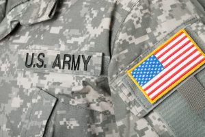 Focused image on U.S. Army name tape and American flag patch