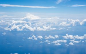soft white clouds over the blue ocean