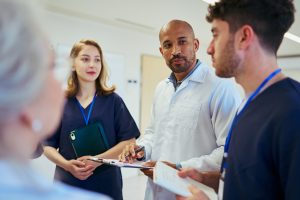 A hospice team talking to a hospice patient