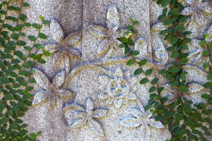 Flower and vine design carved into headstone